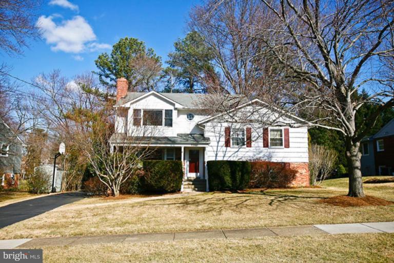 2001 Mcfall Street McLean, VA 22101 - Photo 4 of 4 a front view of a house with a yard and garage