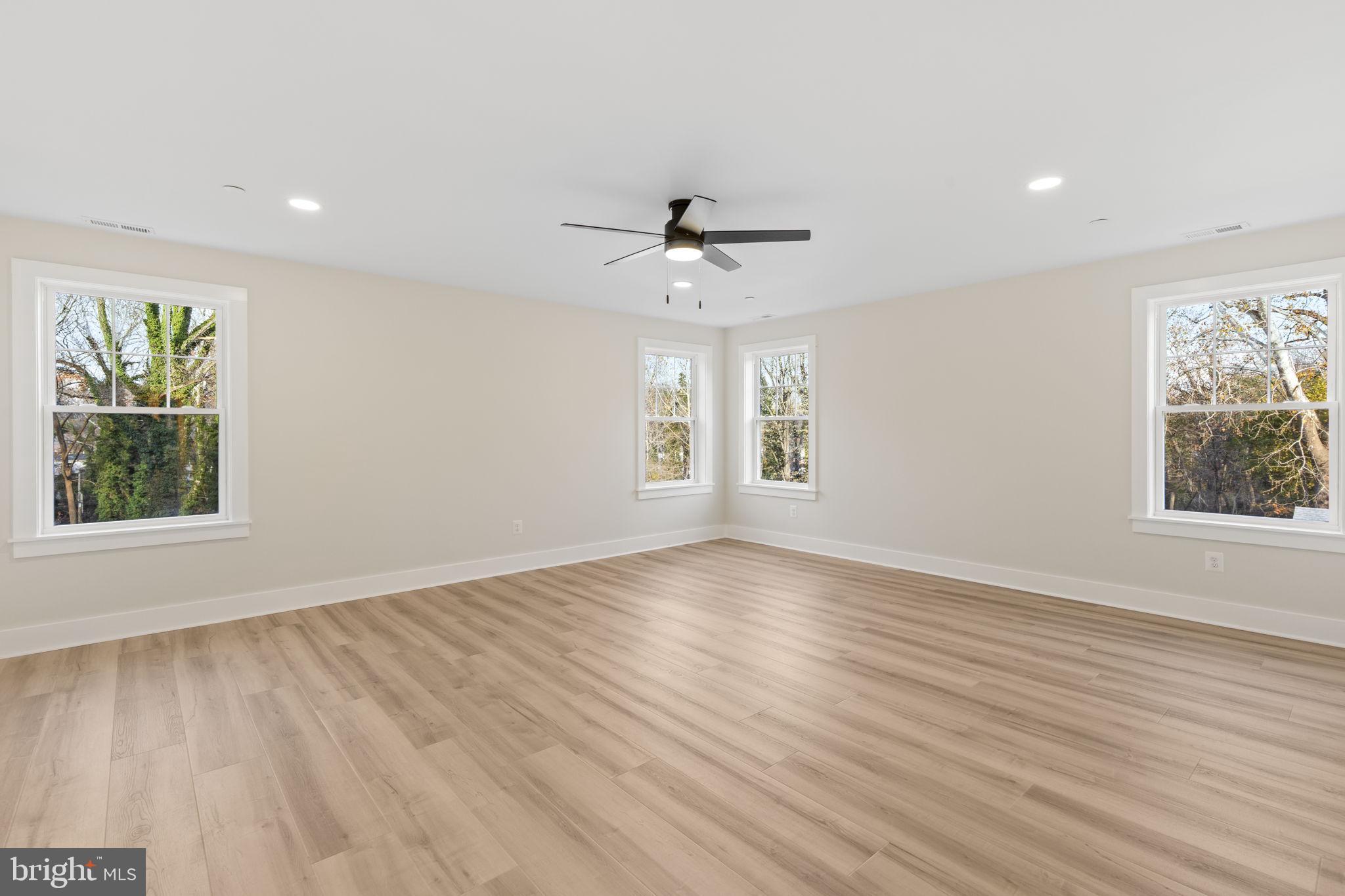 1108 Litchfield Road Baltimore, MD 21239 - Photo 20 of 109 wooden floor in an empty room with a window