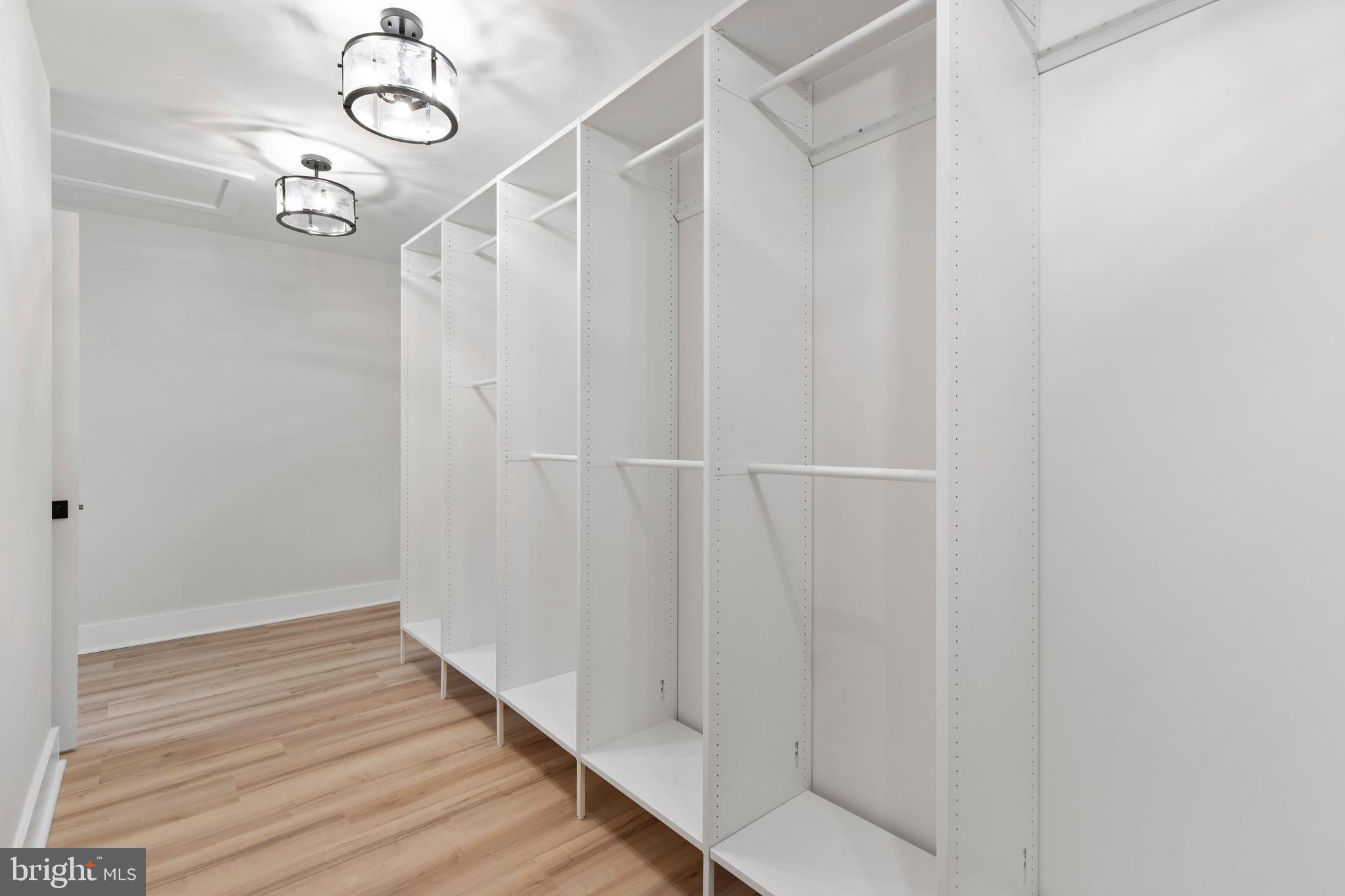 1108 Litchfield Road Baltimore, MD 21239 - Photo 30 of 109 a view of a hallway with wooden floor and staircase