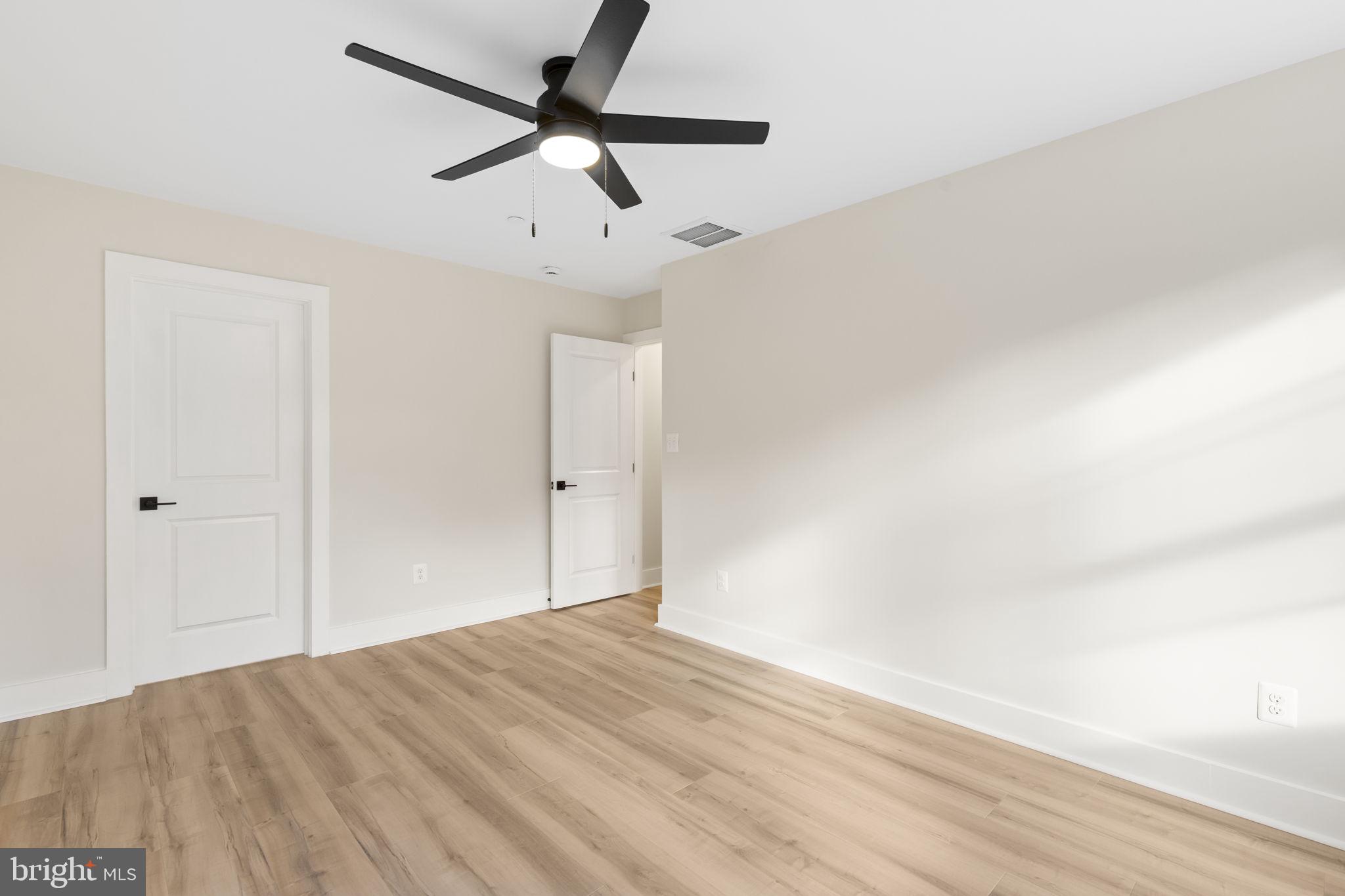 1108 Litchfield Road Baltimore, MD 21239 - Photo 36 of 109 a view of empty room with wooden floor