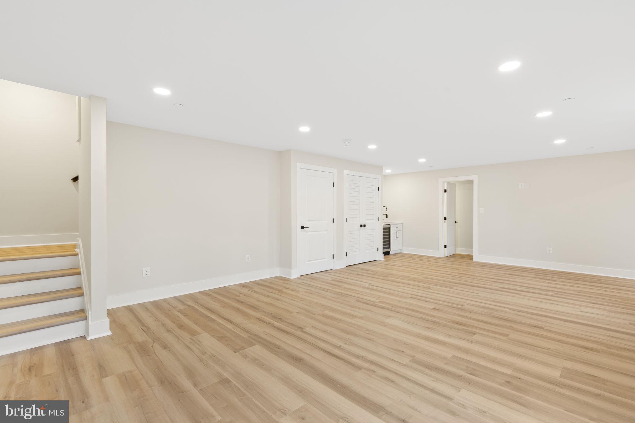 1108 Litchfield Road Baltimore, MD 21239 - Photo 40 of 109 a view of empty room with wooden floor