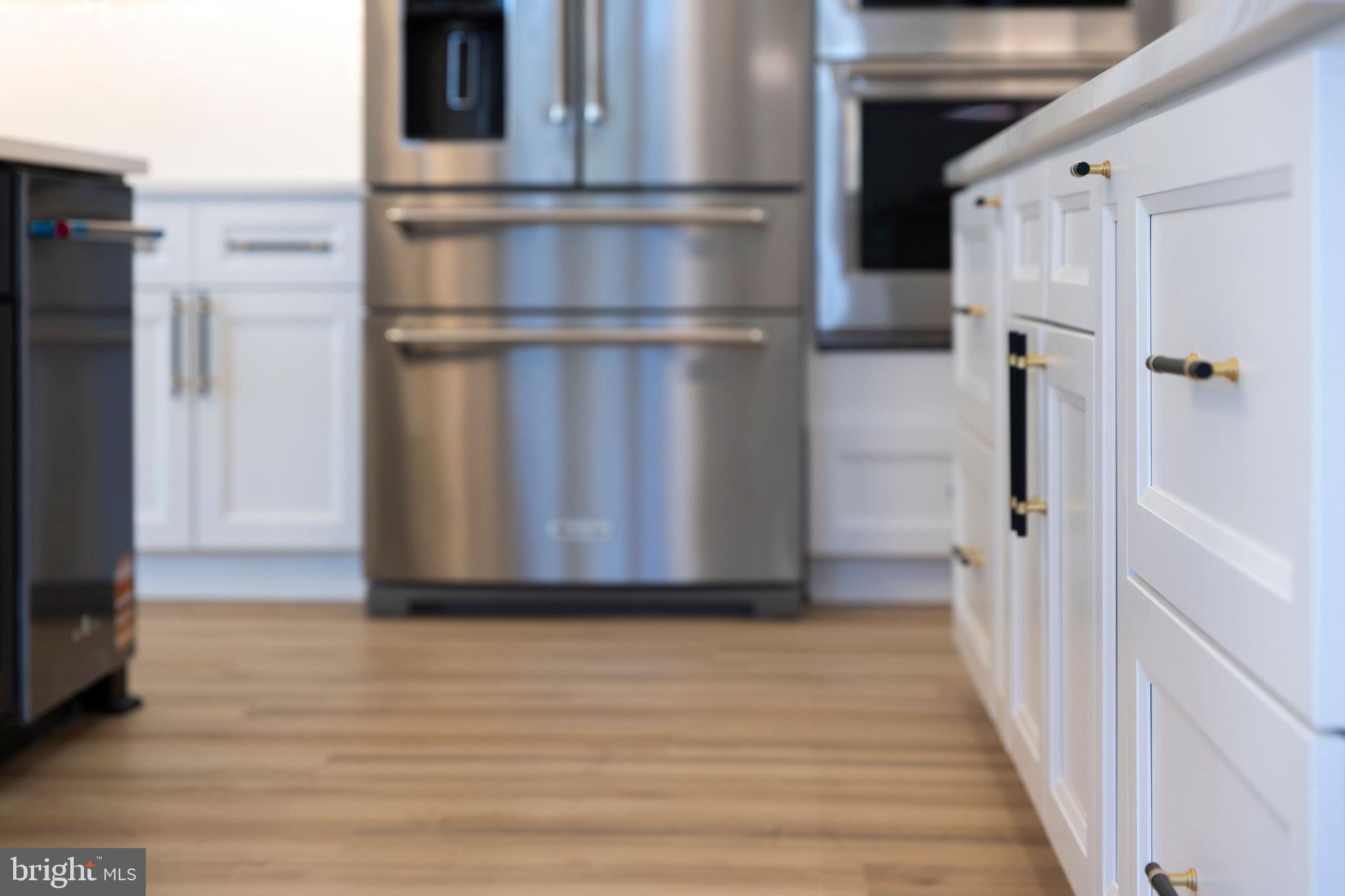 1108 Litchfield Road Baltimore, MD 21239 - Photo 59 of 109 a view of a hallway with wooden floor and staircase