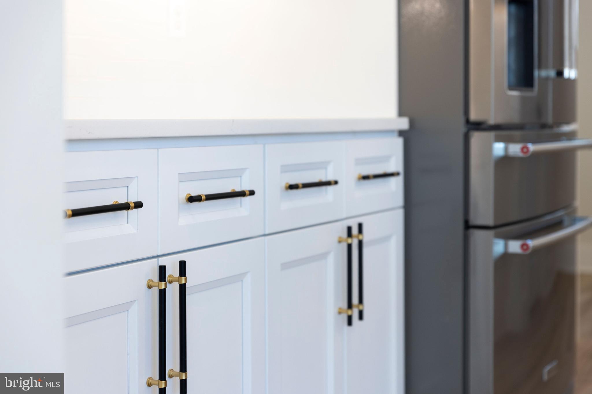 1108 Litchfield Road Baltimore, MD 21239 - Photo 62 of 109 a kitchen with a refrigerator and cabinets