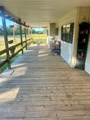 a view of a living room and kitchen floor