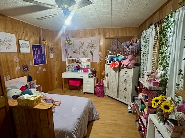 a bed room with a bed and a desk