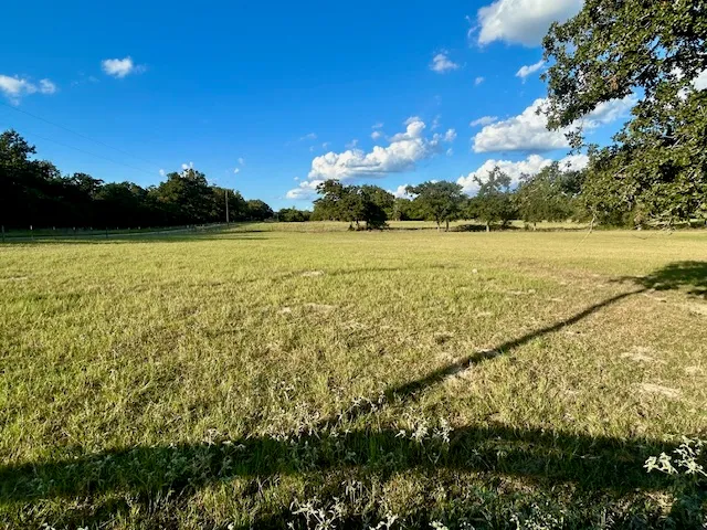 a view of an ocean and a yard