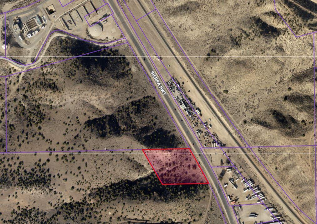 Sierra Highway Palmdale, CA 93550 - Photo 6 of 7 a bed with white sheets and pillows