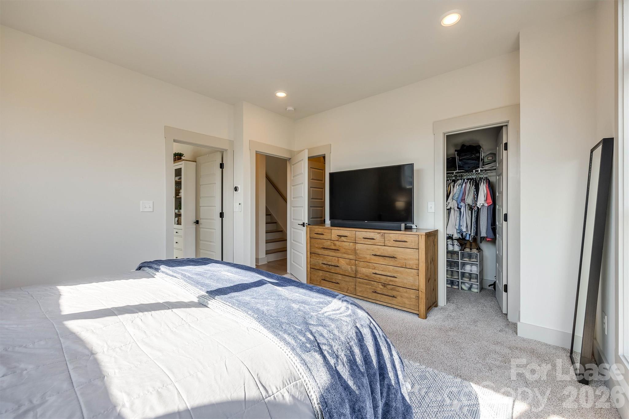 2319 Wesley Village Road Charlotte, NC 28208 - Photo 29 of 44 a bedroom with a bed and a flat screen tv