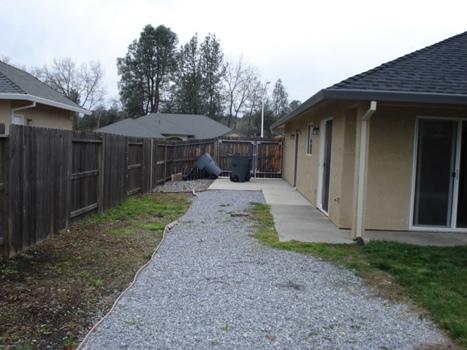 7553 Pit Road Redding, CA 96001 - Photo 12 of 12 a front view of a house with garden