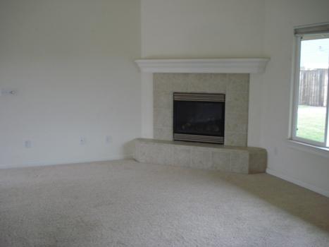 7553 Pit Road Redding, CA 96001 - Photo 7 of 12 an empty room with a fireplace