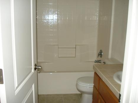 7553 Pit Road Redding, CA 96001 - Photo 9 of 12 a bathroom with a sink a toilet and shower