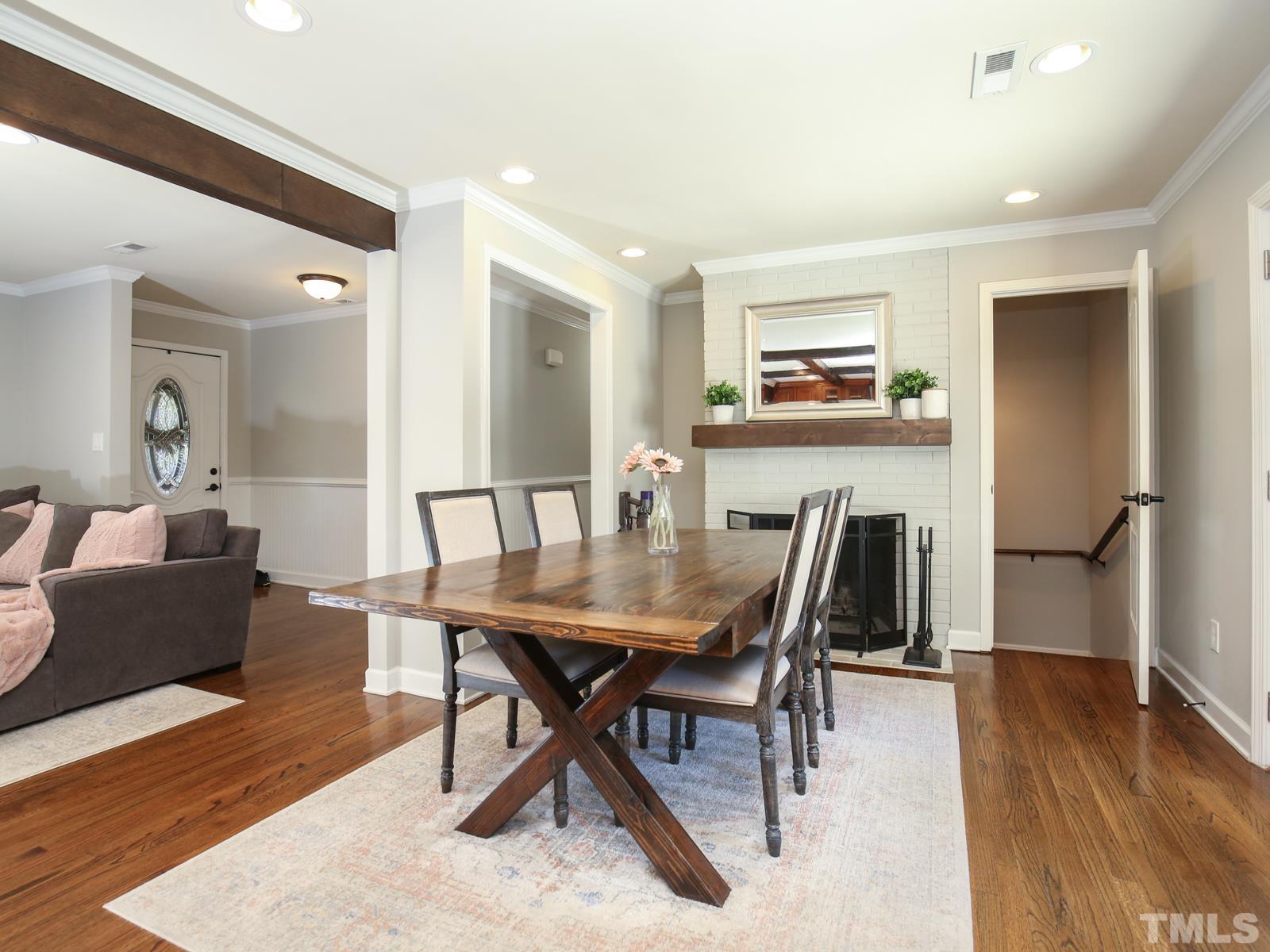 6013 Trinity Drive Raleigh, NC 27607 - Photo 11 of 30 a view of a dining room with furniture and wooden floor