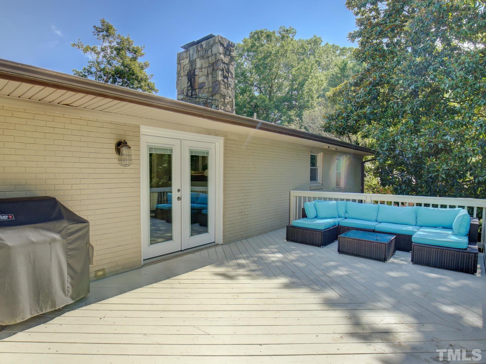 6013 Trinity Drive Raleigh, NC 27607 - Photo 19 of 30 a front view of a house with garden