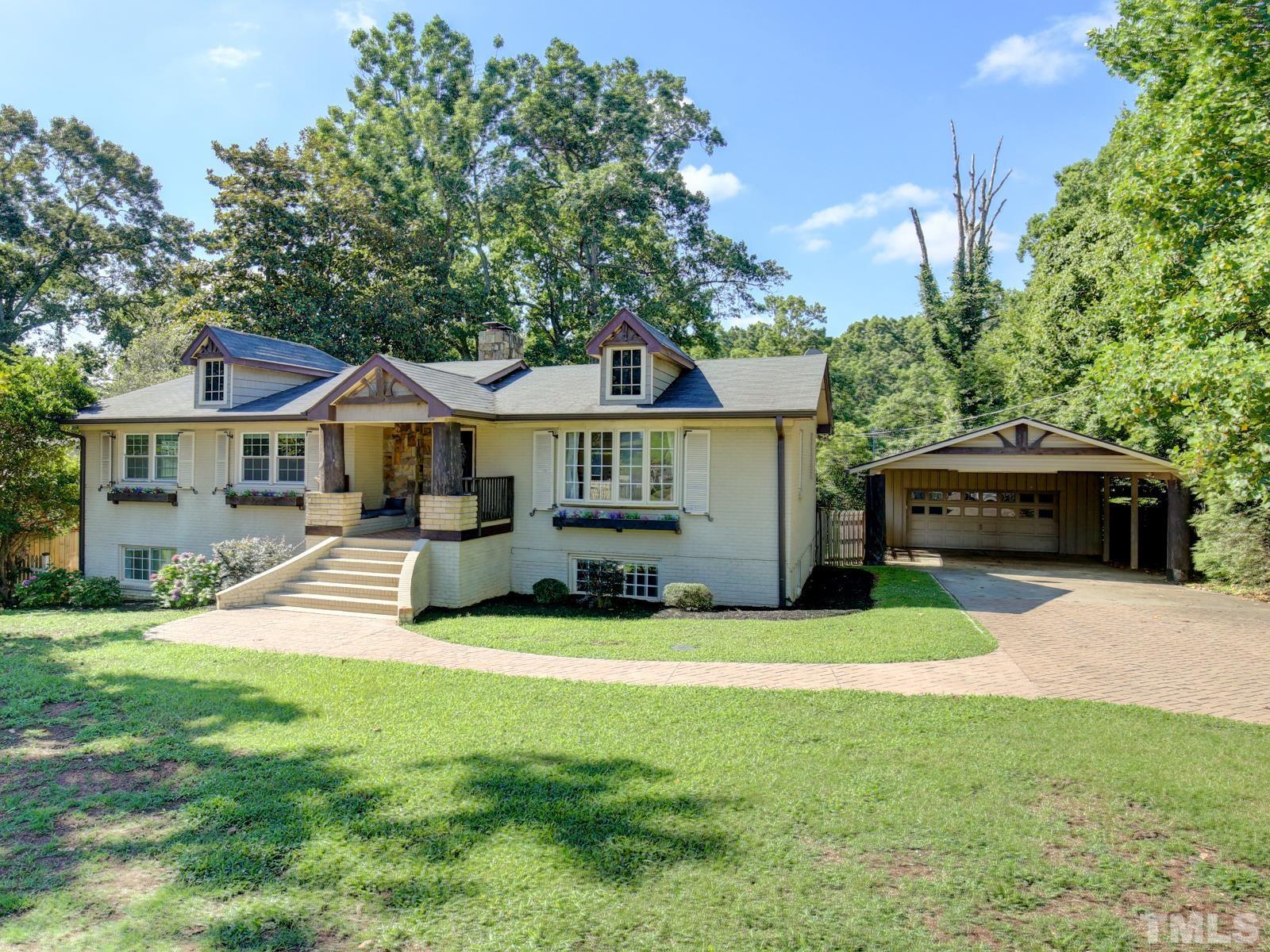 6013 Trinity Drive Raleigh, NC 27607 - Photo 2 of 30 a front view of a house with a yard