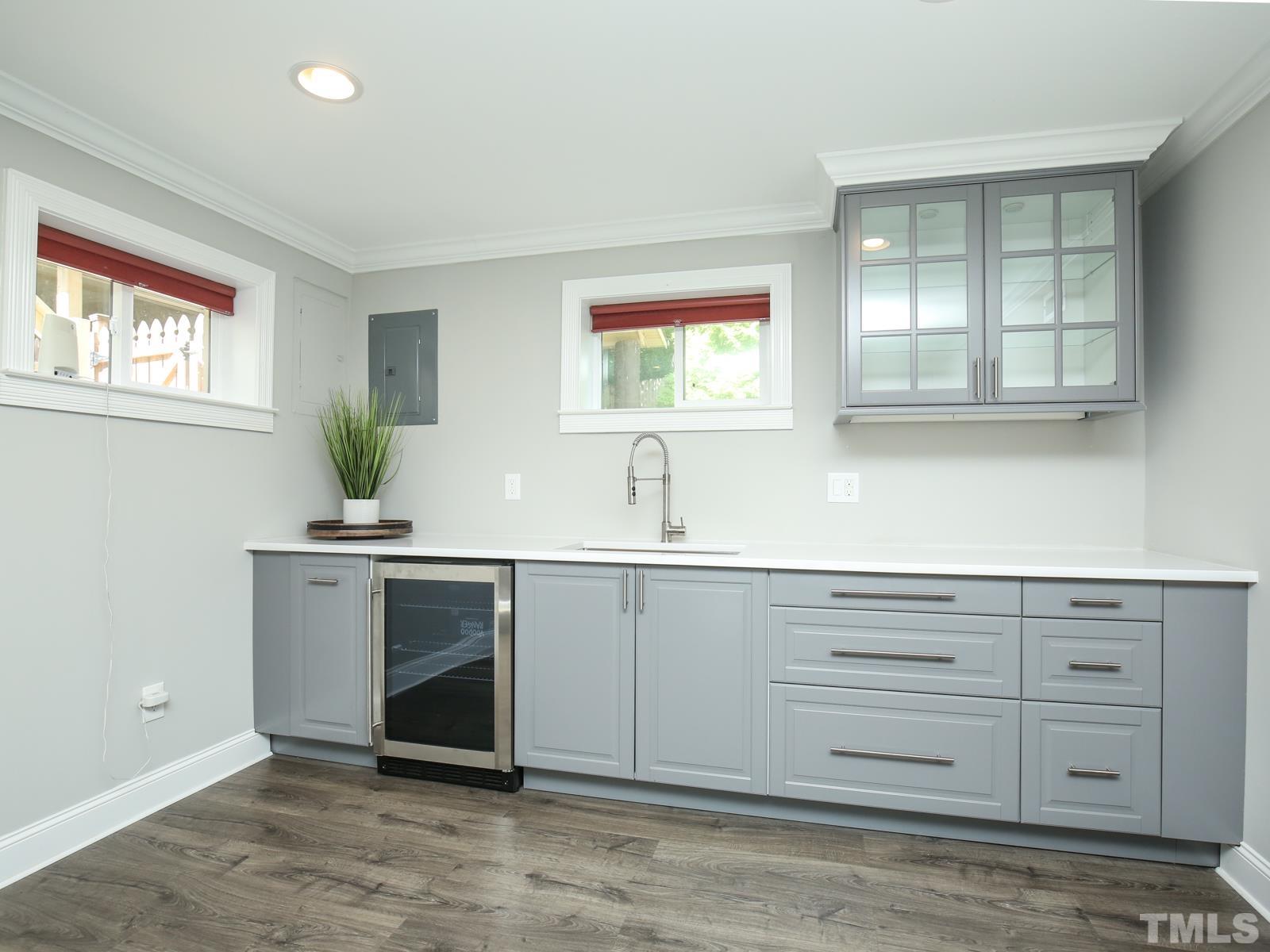 6013 Trinity Drive Raleigh, NC 27607 - Photo 21 of 30 a view with cabinets a sink and a window