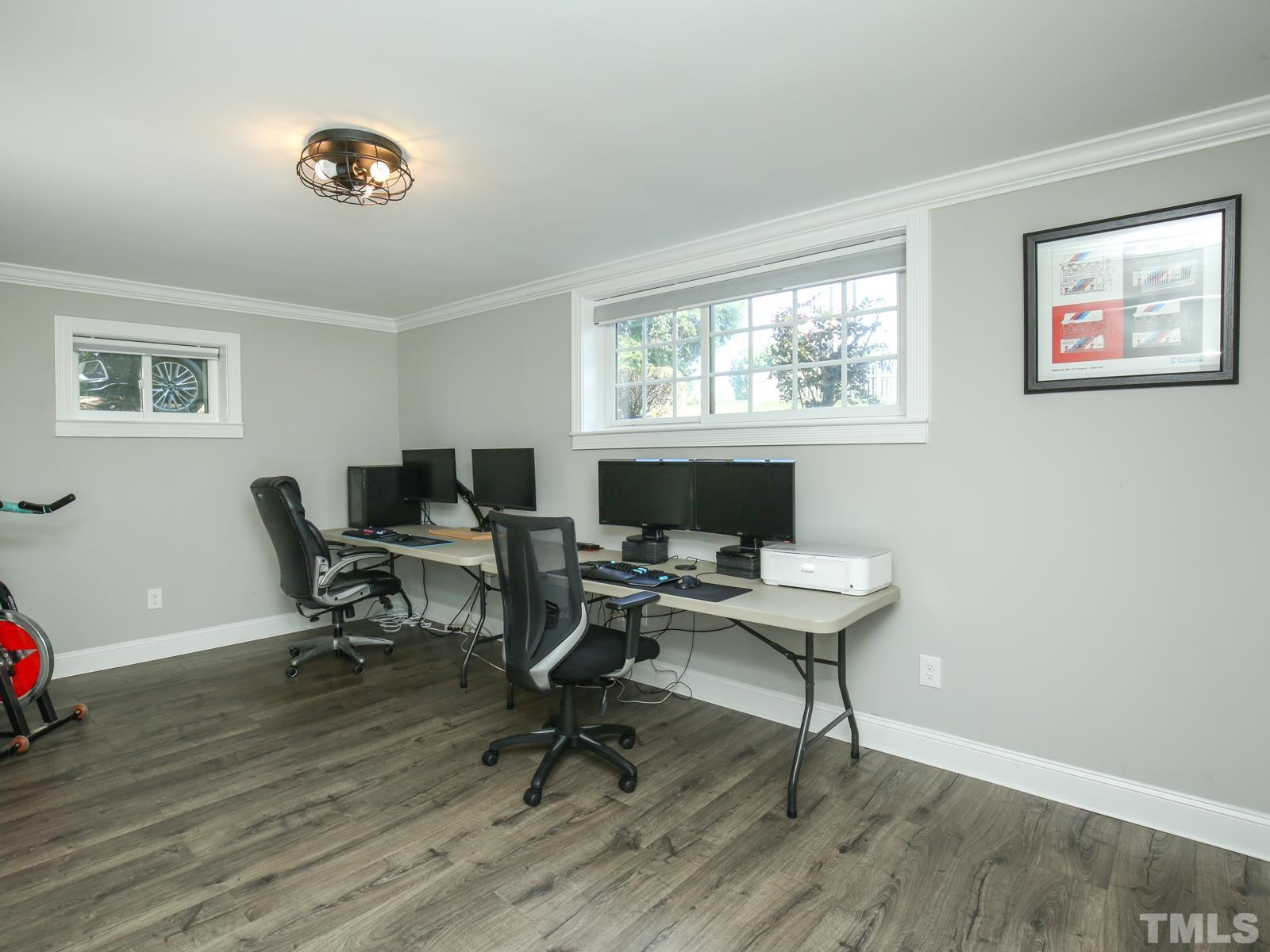 6013 Trinity Drive Raleigh, NC 27607 - Photo 23 of 30 a view of a workspace with wooden floor