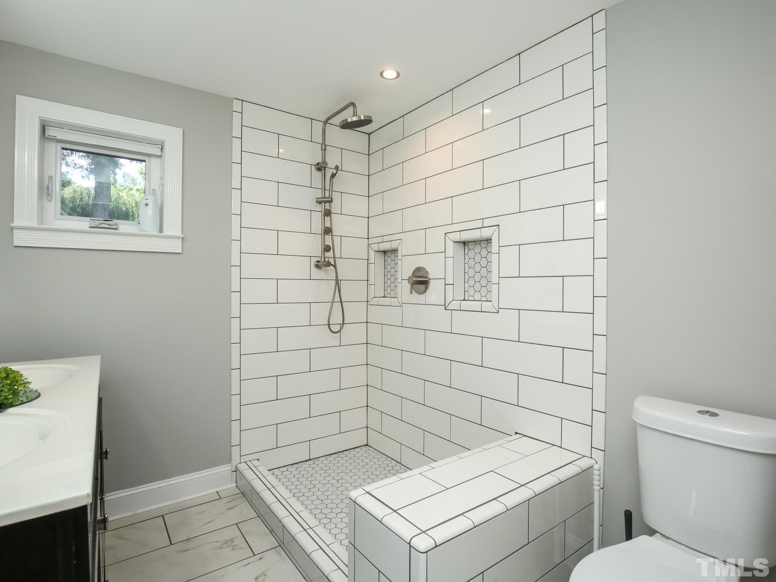 6013 Trinity Drive Raleigh, NC 27607 - Photo 25 of 30 a bathroom with a shower and toilet