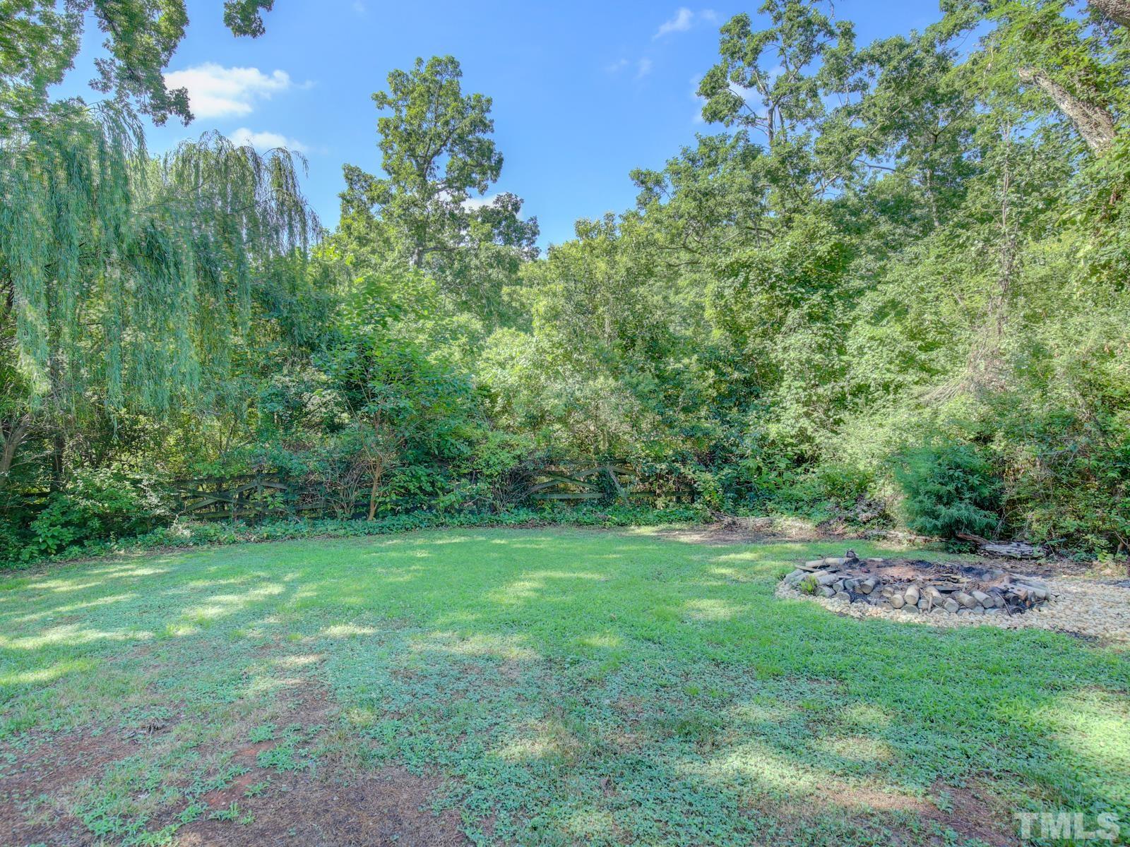 6013 Trinity Drive Raleigh, NC 27607 - Photo 27 of 30 a view of a grassy field with trees