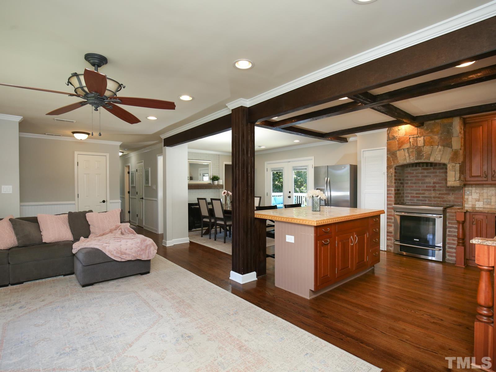 6013 Trinity Drive Raleigh, NC 27607 - Photo 6 of 30 a large bedroom with furniture and fireplace