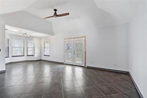 1616 North Pecos Street Lockhart, TX 78644 - Photo 11 of 27 a view of an empty room with wooden floor and a window