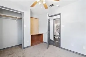 a view of an empty room and fire place