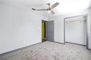 1616 North Pecos Street Lockhart, TX 78644 - Photo 22 of 27 an empty room with fan and a ceiling fan