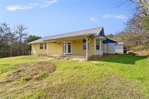 1616 North Pecos Street Lockhart, TX 78644 - Photo 24 of 27 a view of a house with a backyard