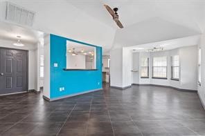 1616 North Pecos Street Lockhart, TX 78644 - Photo 5 of 27 a view of an empty room with window and wooden floor