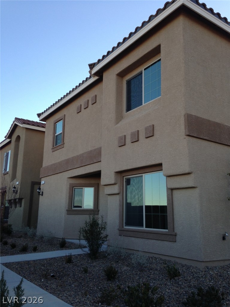 9453 Alma Ridge Avenue Las Vegas, NV 89178 - Photo 1 of 25 A well-maintained stucco facade with a terracotta-tiled roof welcomes you home.