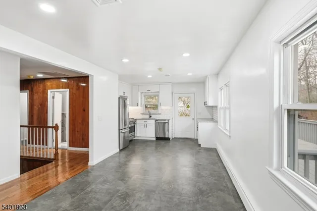 a view of a kitchen with a sink and dishwasher open kitchen view