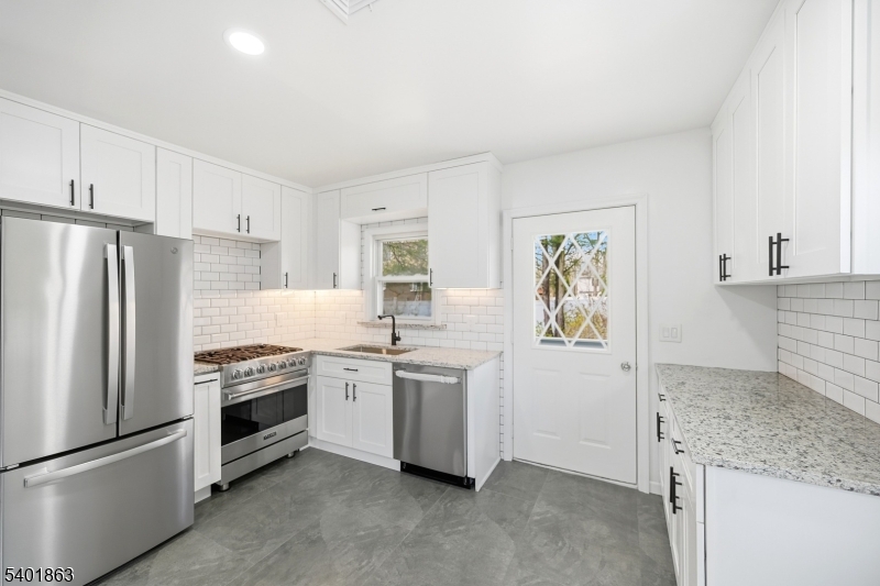 4 Rainbow Trail Vernon, NJ 07422 - Photo 27 of 41 a kitchen with stainless steel appliances granite countertop a refrigerator a stove and a sink