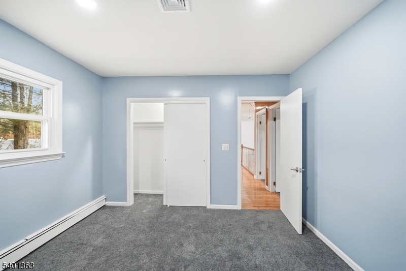 4 Rainbow Trail Vernon, NJ 07422 - Photo 33 of 41 an empty room with windows and closet