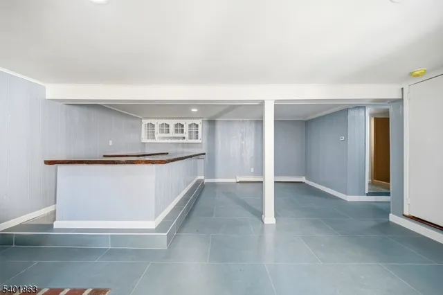 a view of kitchen with stainless steel appliances cabinets and outdoor space