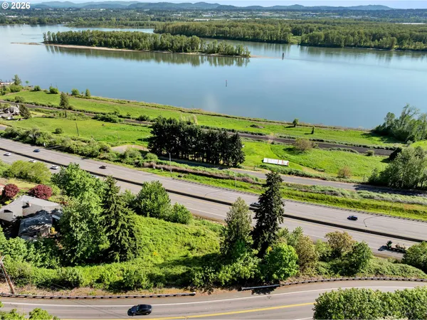 an aerial view of a house with a lake view
