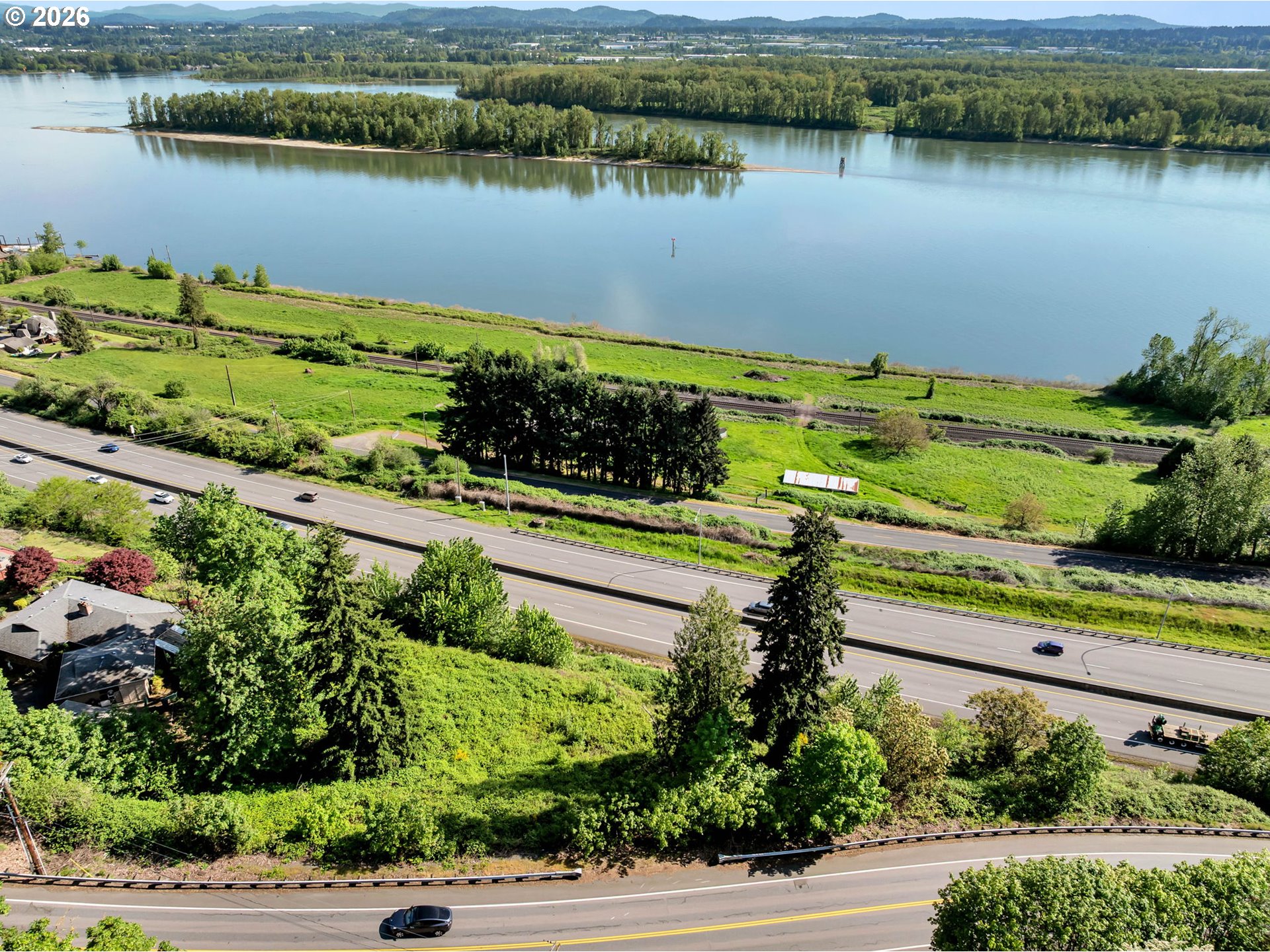 580 Northwest Brady Road Camas, WA 98607 - Photo 1 of 27 an aerial view of a house with a lake view