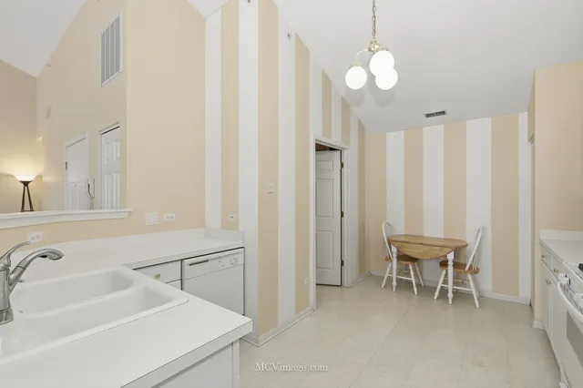 a utility room with cabinets