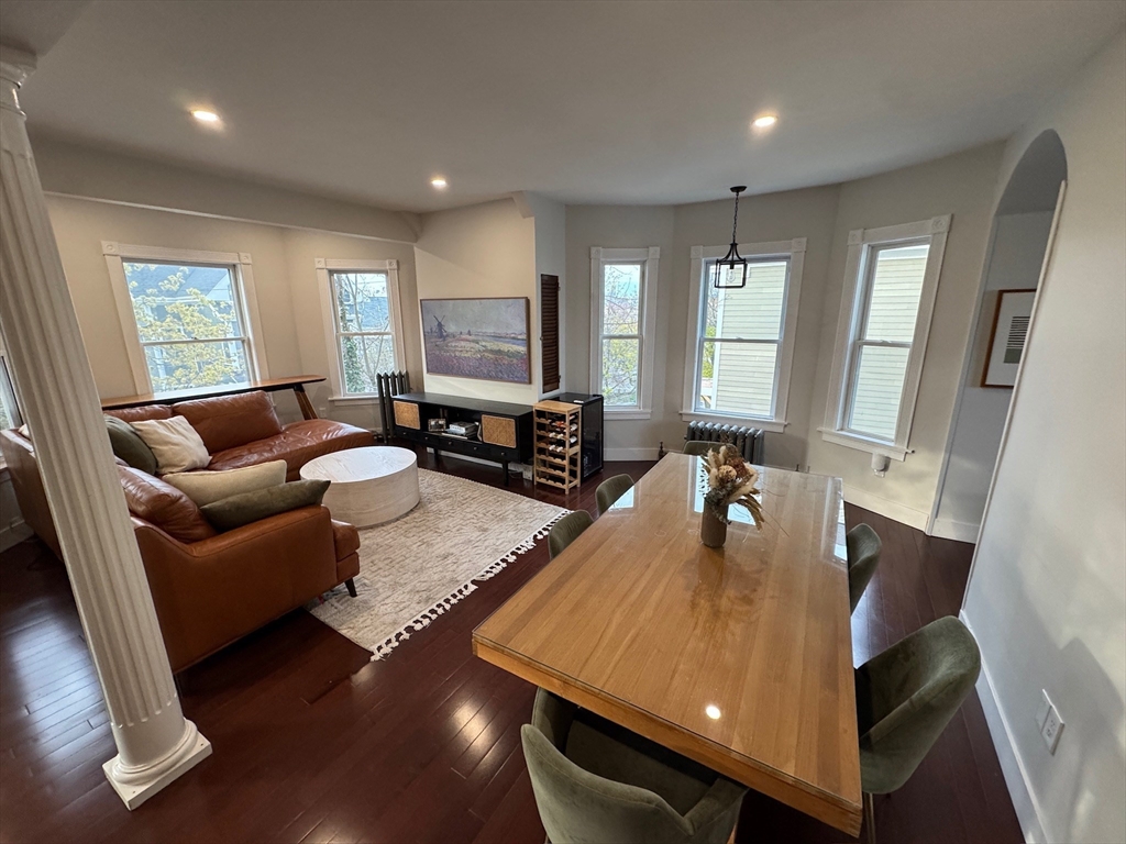 38 Pinckney Street, Unit 3 Somerville, MA 02145 - Photo 12 of 40 a living room with furniture and a flat screen tv