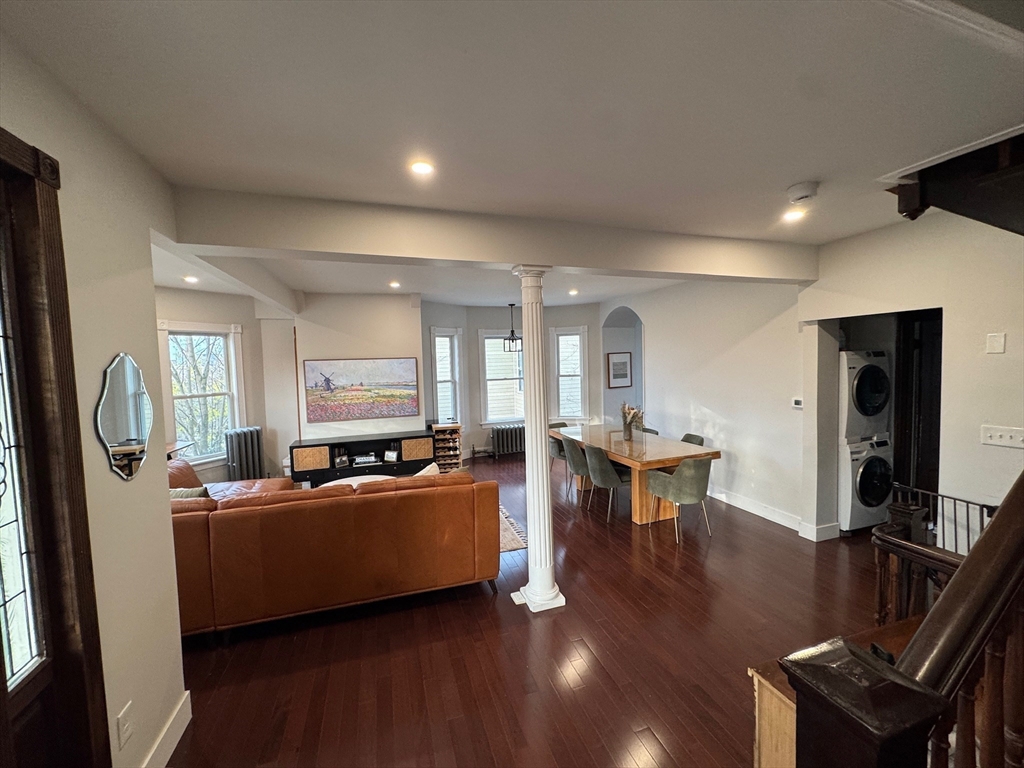 38 Pinckney Street, Unit 3 Somerville, MA 02145 - Photo 13 of 40 a living room with furniture a flat screen tv and a table
