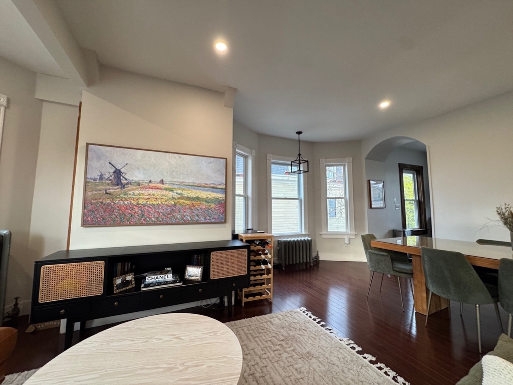 38 Pinckney Street, Unit 3 Somerville, MA 02145 - Photo 15 of 40 a living room with furniture window and wooden floor