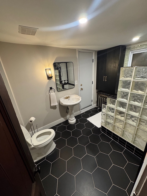 38 Pinckney Street, Unit 3 Somerville, MA 02145 - Photo 16 of 40 a bathroom with a sink toilet and a mirror