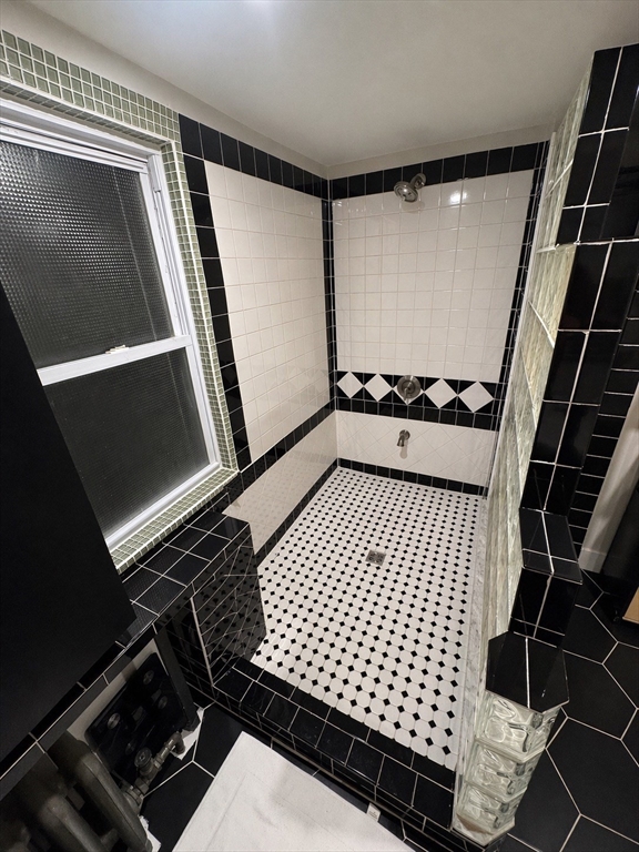 38 Pinckney Street, Unit 3 Somerville, MA 02145 - Photo 17 of 40 a bathroom with a shower