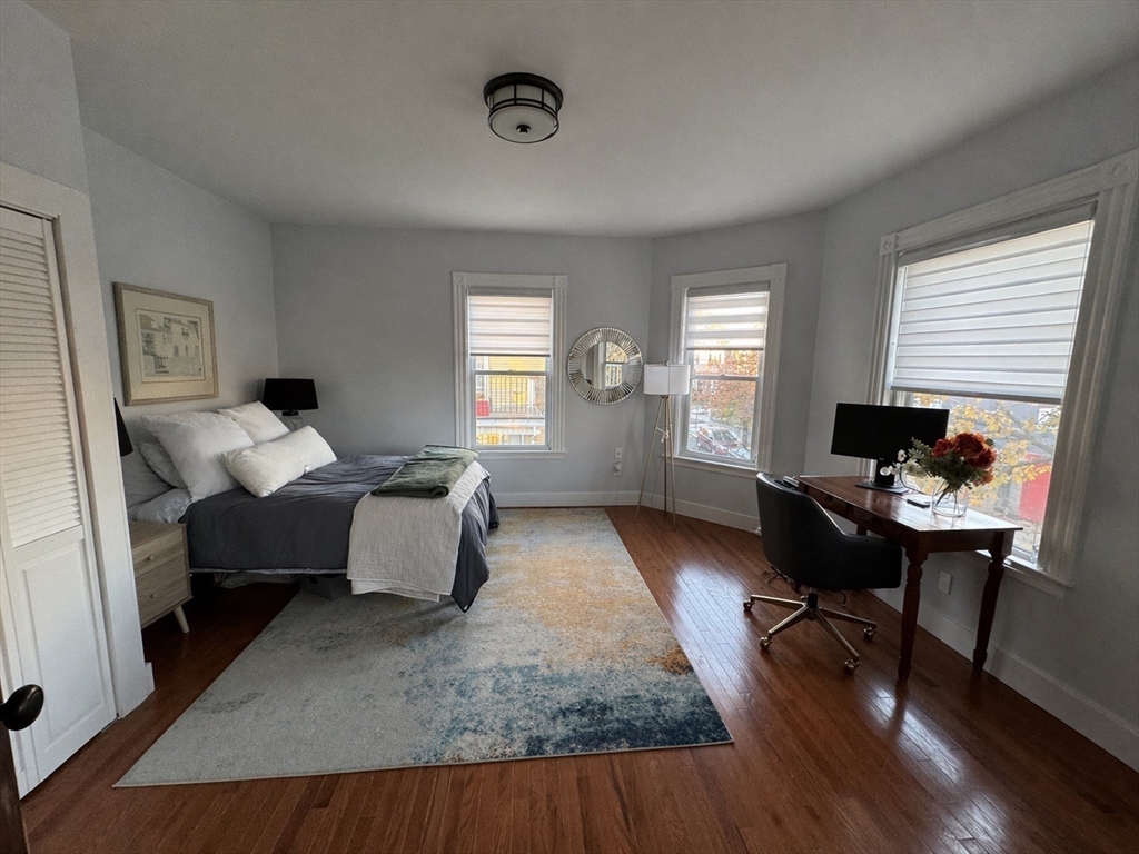 38 Pinckney Street, Unit 3 Somerville, MA 02145 - Photo 19 of 40 a living room with furniture and wooden floor