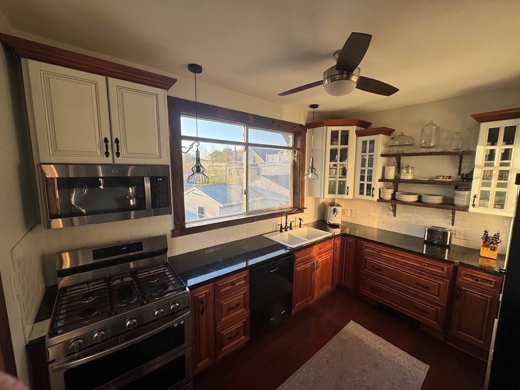 38 Pinckney Street, Unit 3 Somerville, MA 02145 - Photo 2 of 40 a kitchen with stainless steel appliances sink stove and cabinets
