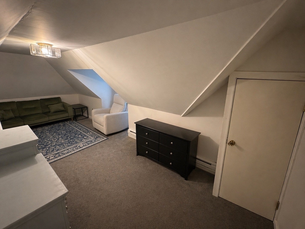 38 Pinckney Street, Unit 3 Somerville, MA 02145 - Photo 28 of 40 a room with stairs and furniture