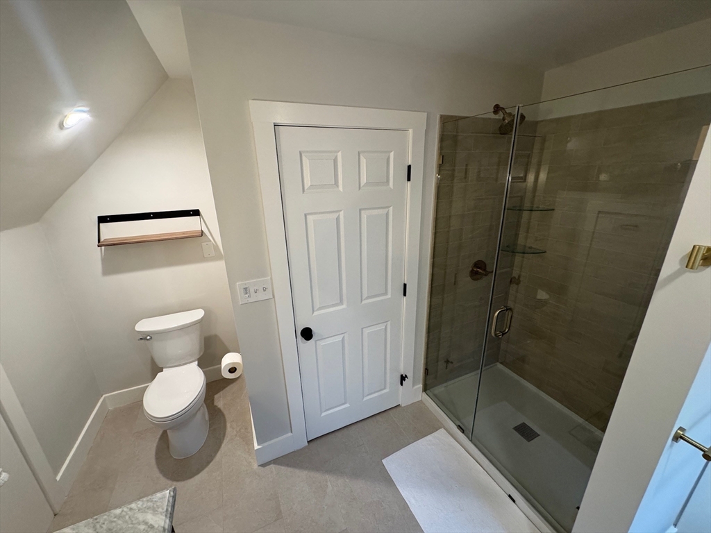38 Pinckney Street, Unit 3 Somerville, MA 02145 - Photo 29 of 40 a bathroom with a shower and toilet