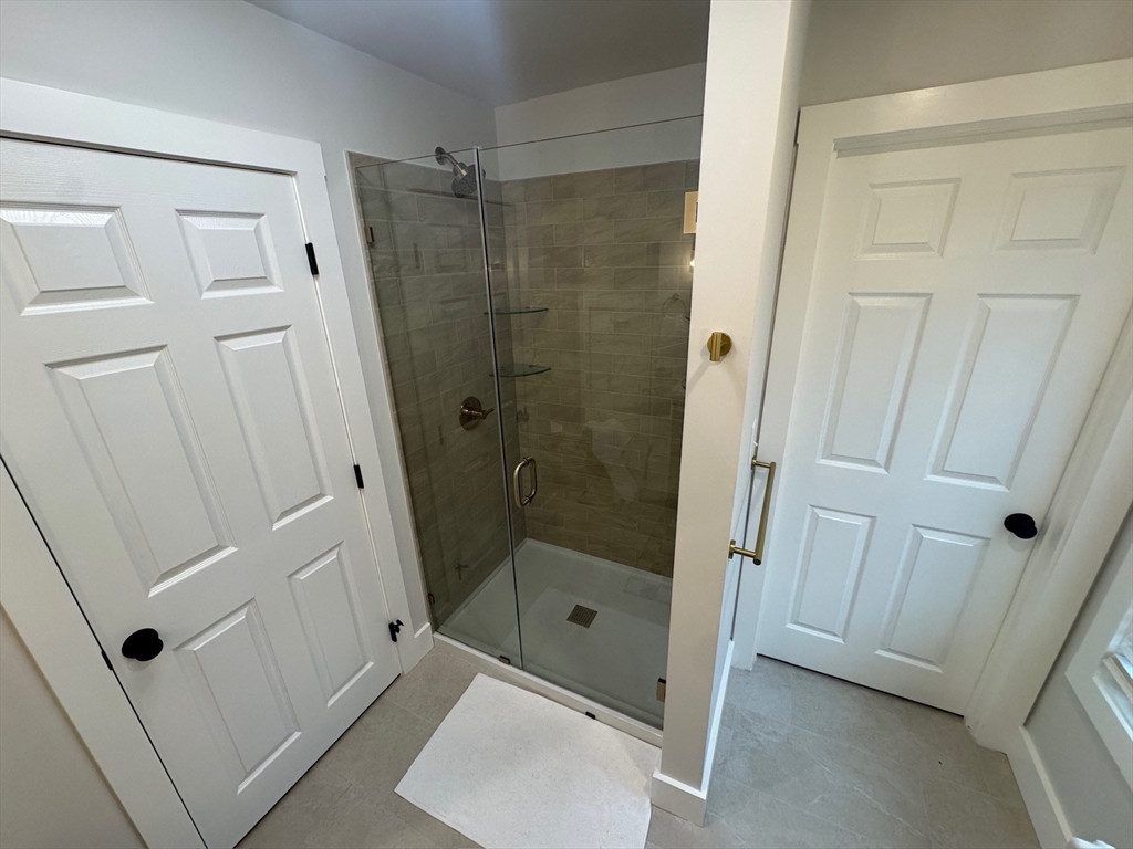 38 Pinckney Street, Unit 3 Somerville, MA 02145 - Photo 30 of 40 a bathroom with a shower and a sink