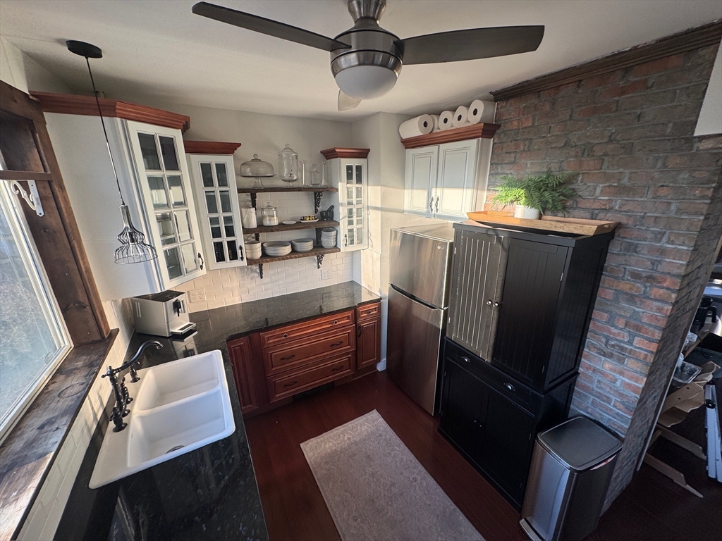 38 Pinckney Street, Unit 3 Somerville, MA 02145 - Photo 3 of 40 a kitchen with a refrigerator and a stove
