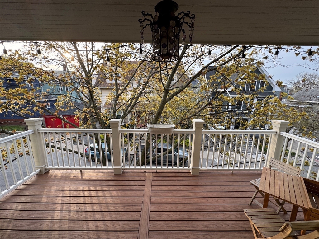 38 Pinckney Street, Unit 3 Somerville, MA 02145 - Photo 33 of 40 a view of a balcony with wooden floor