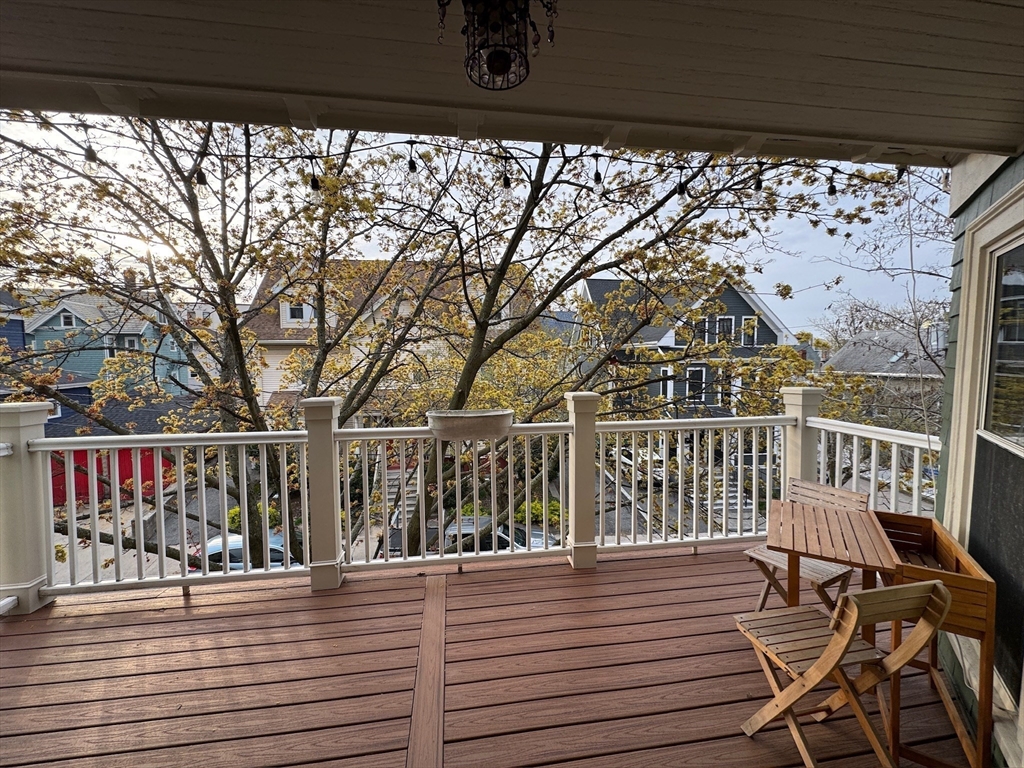 38 Pinckney Street, Unit 3 Somerville, MA 02145 - Photo 35 of 40 a view of a balcony with wooden chairs