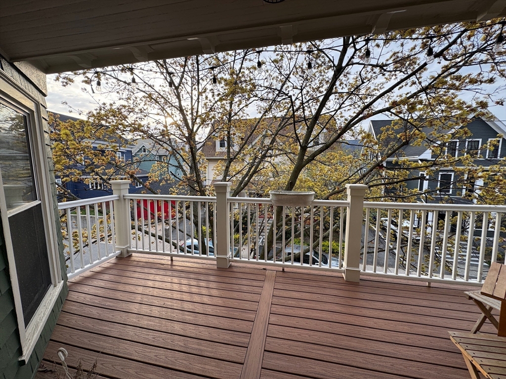 38 Pinckney Street, Unit 3 Somerville, MA 02145 - Photo 36 of 40 a view of a balcony with wooden floor